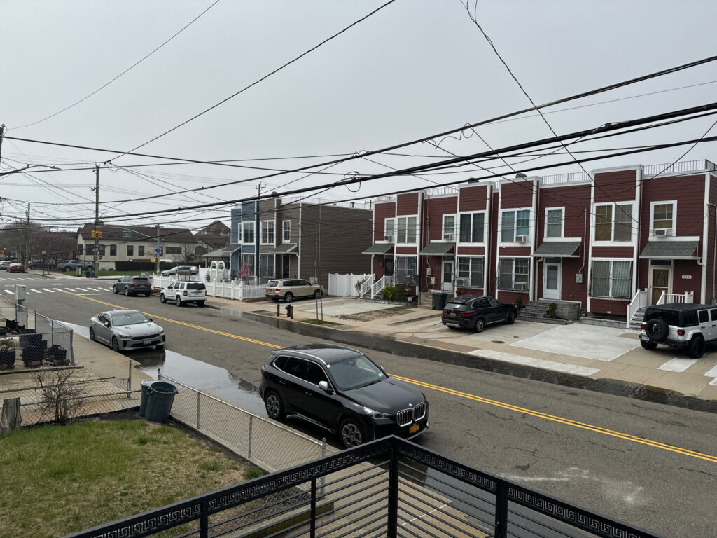 a street with cars and houses along it (MyCoast AI)