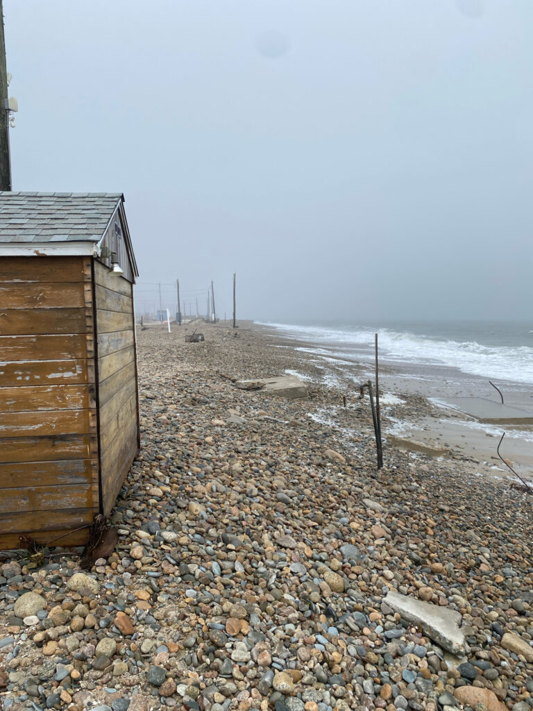 a rocky beach with a shack (MyCoast AI)