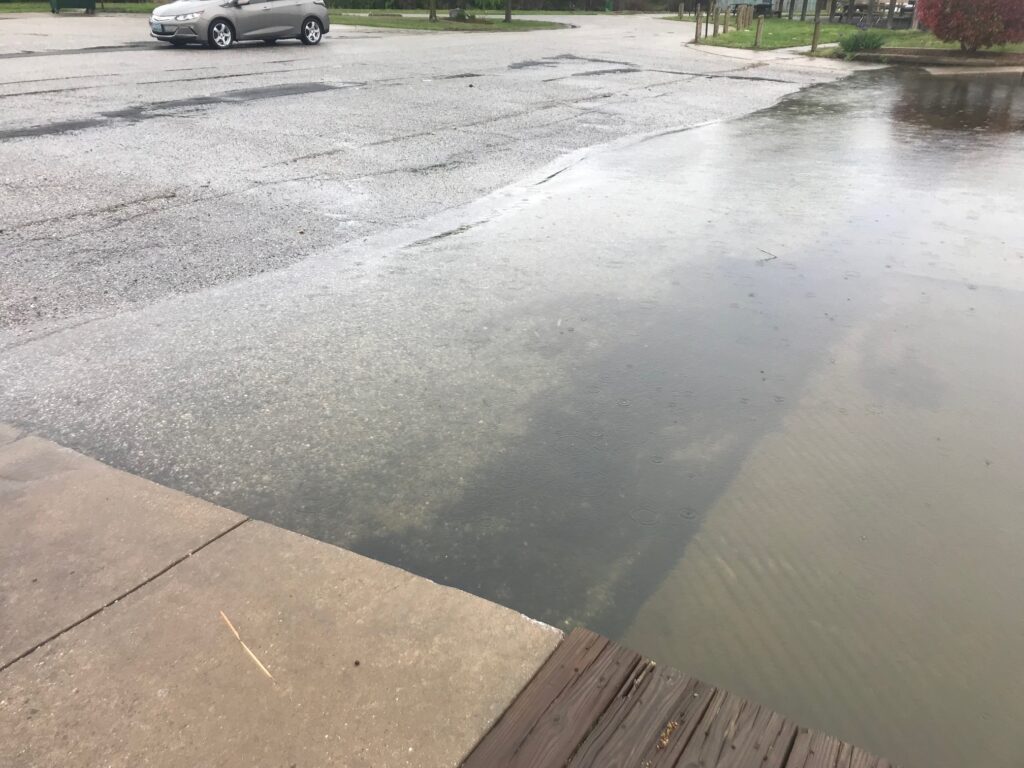 a puddle on the ground (MyCoast AI)
