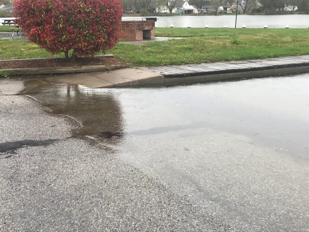 a puddle on the ground (MyCoast AI)