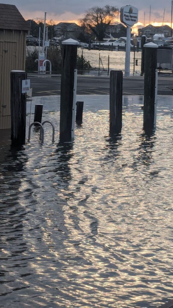 a flooded area with a sign (MyCoast AI)