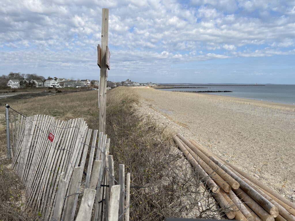 a wooden fence on a beach (MyCoast AI)