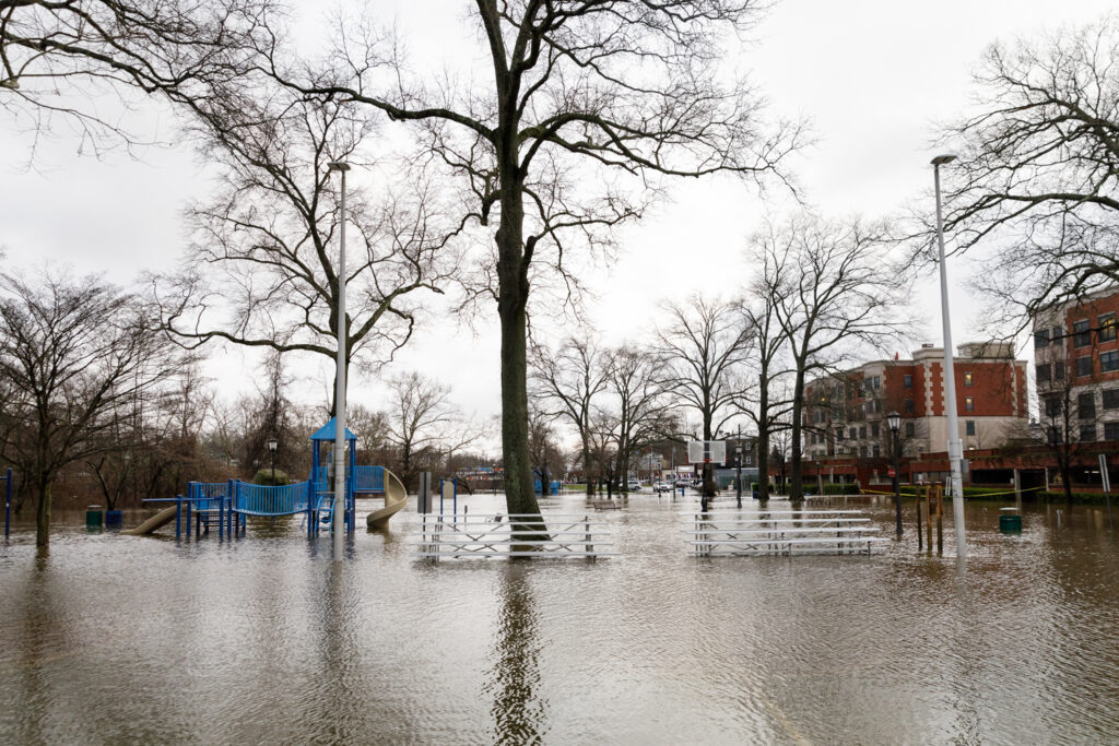 a flooded street with trees and buildings (MyCoast AI)