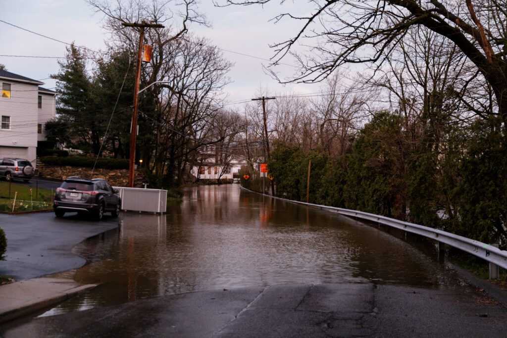 a car driving through a flooded street (MyCoast AI)