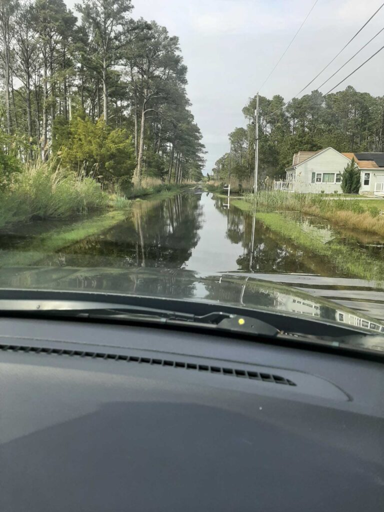 a car driving on a flooded road (MyCoast AI)