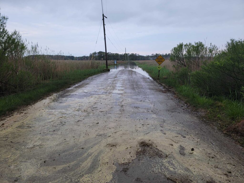 a dirt road with a sign on it (MyCoast AI)