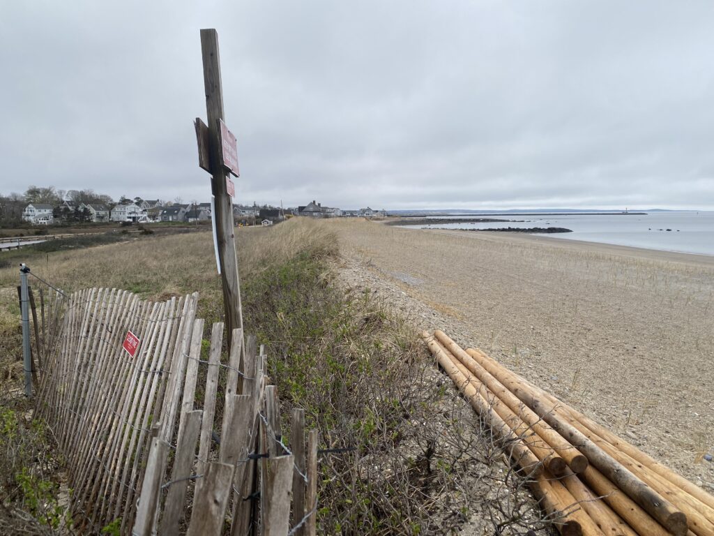 a wooden fence on a beach (MyCoast AI)