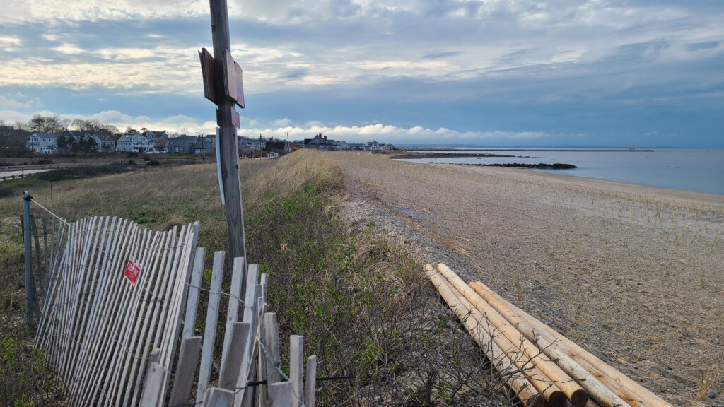 a wooden fence on a beach (MyCoast AI)