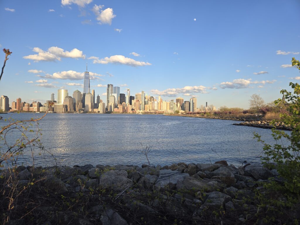 a city skyline across a body of water (MyCoast AI)