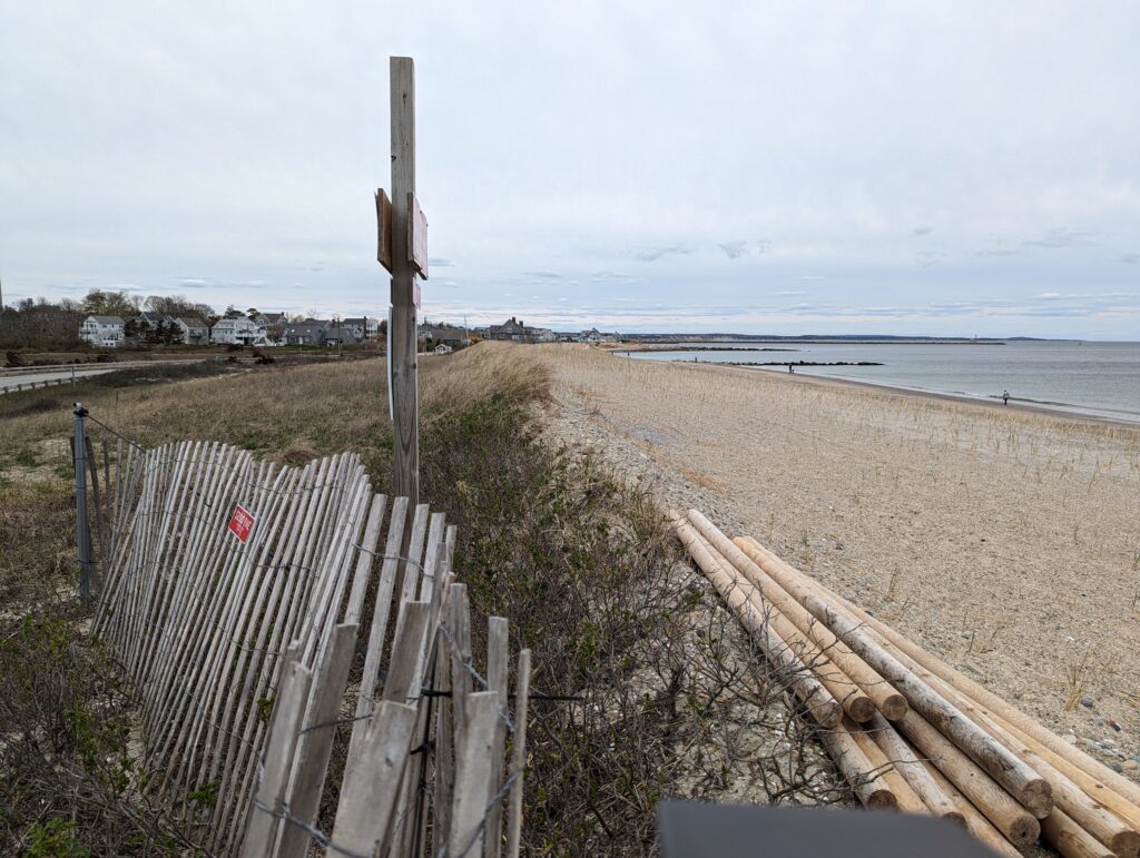 a wooden fence on a beach (MyCoast AI)