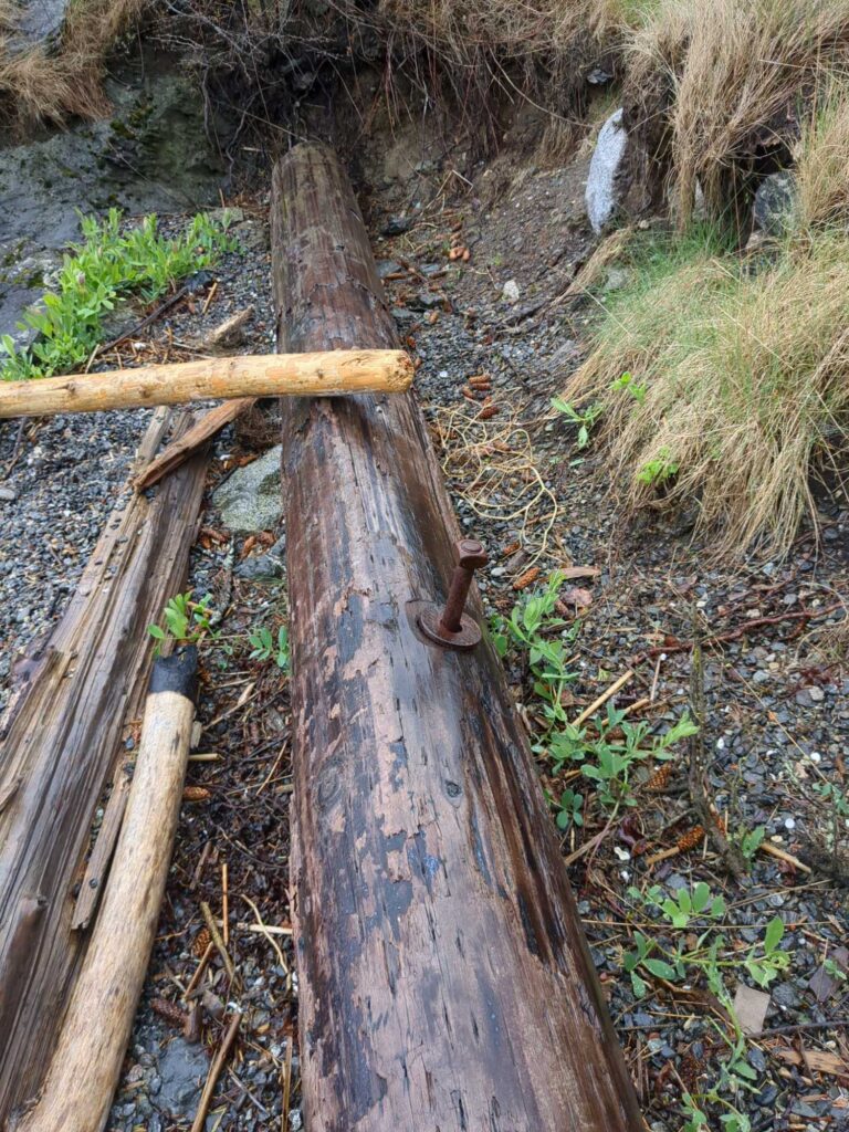 a wooden fence in a field (MyCoast AI)