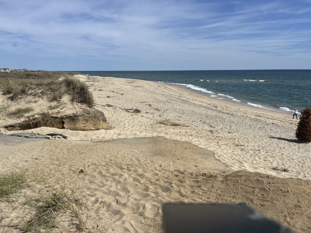 a sandy beach with rocks and water (MyCoast AI)