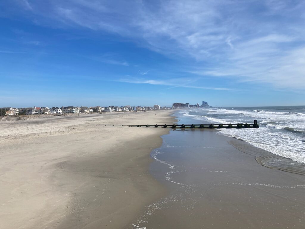 a beach with waves crashing on it (MyCoast AI)