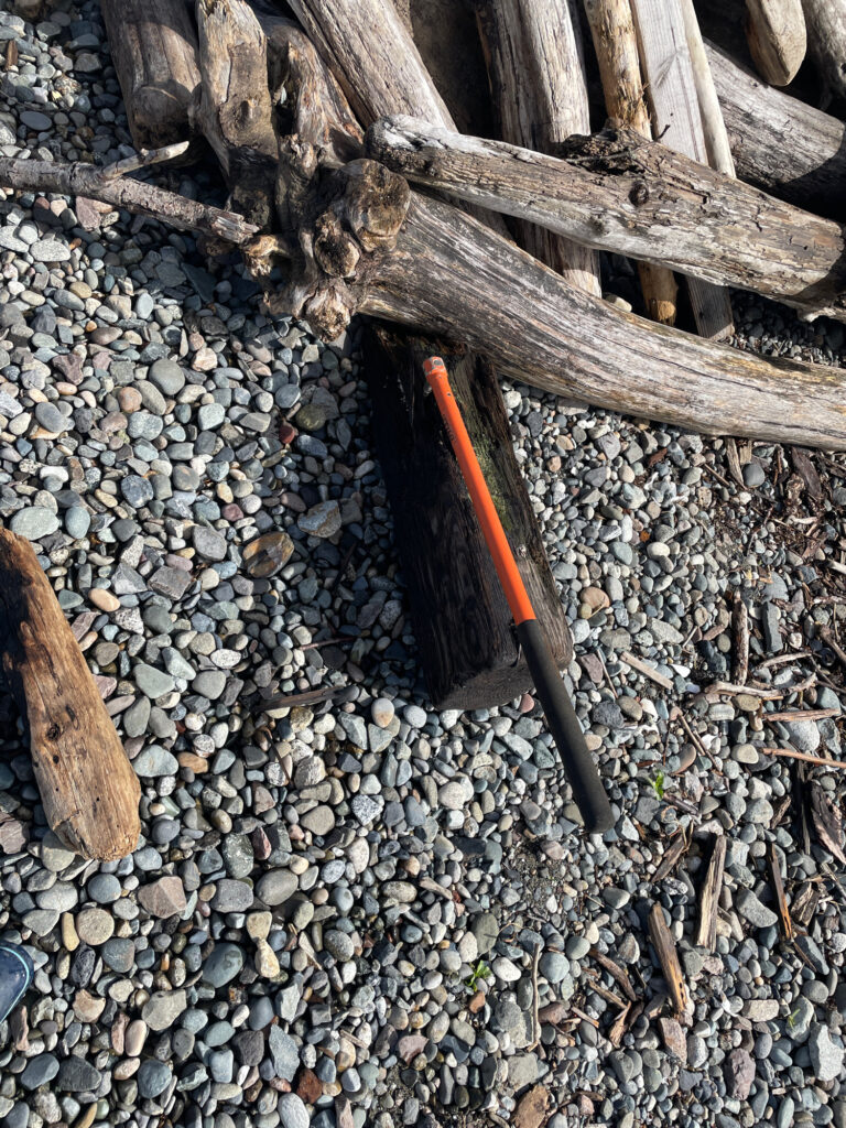 a knife on a pile of rocks (MyCoast AI)