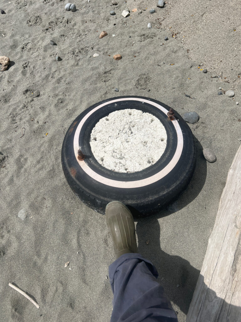 a person's foot on a tire (MyCoast AI)