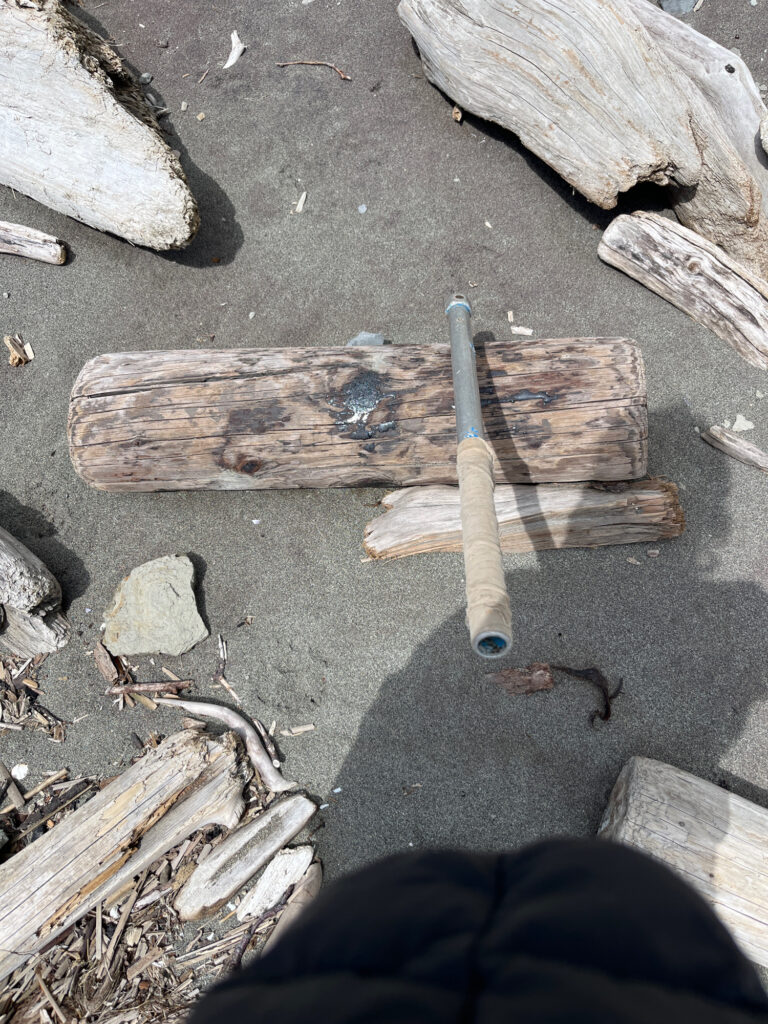 a wooden cross on the ground (MyCoast AI)