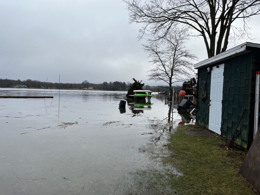 a flooded area with a building and a boat (MyCoast AI)