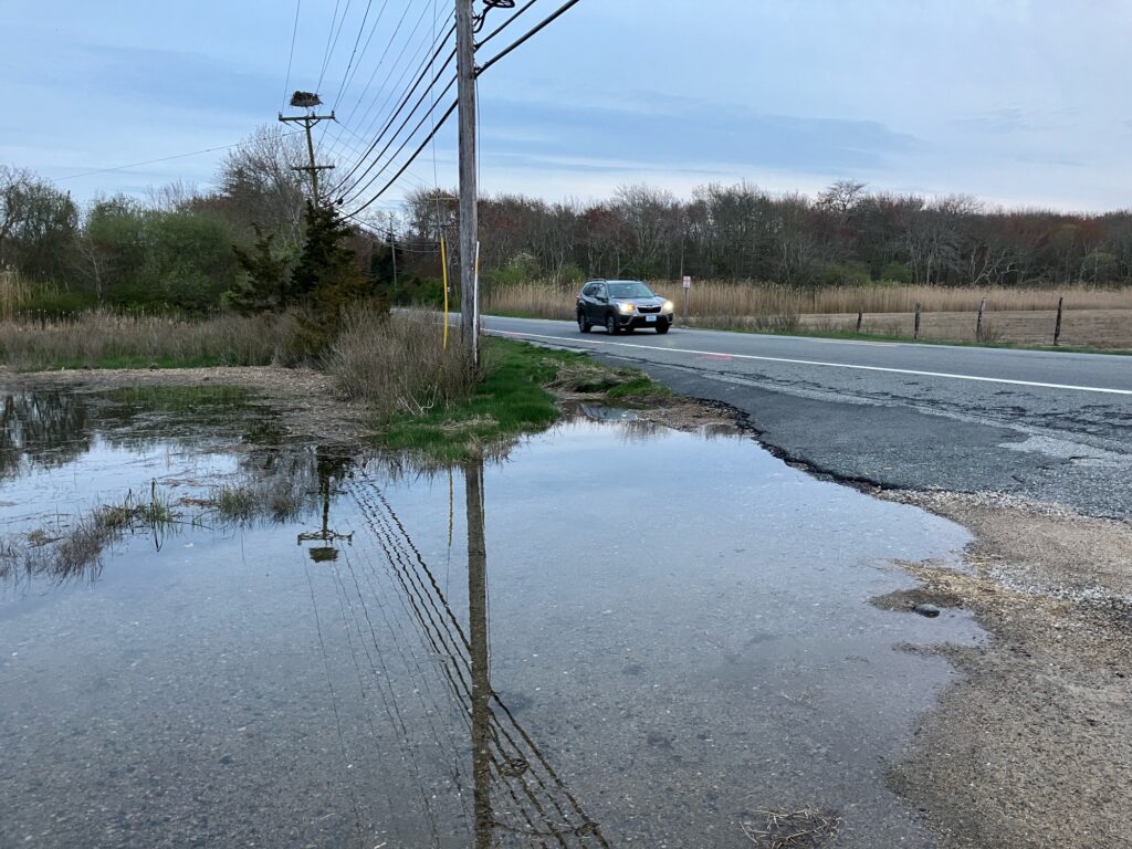a car driving on a wet road (MyCoast AI)