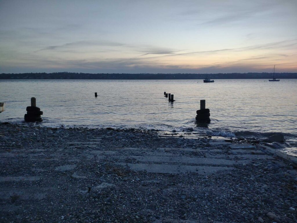 a beach with boats in the water (MyCoast AI)