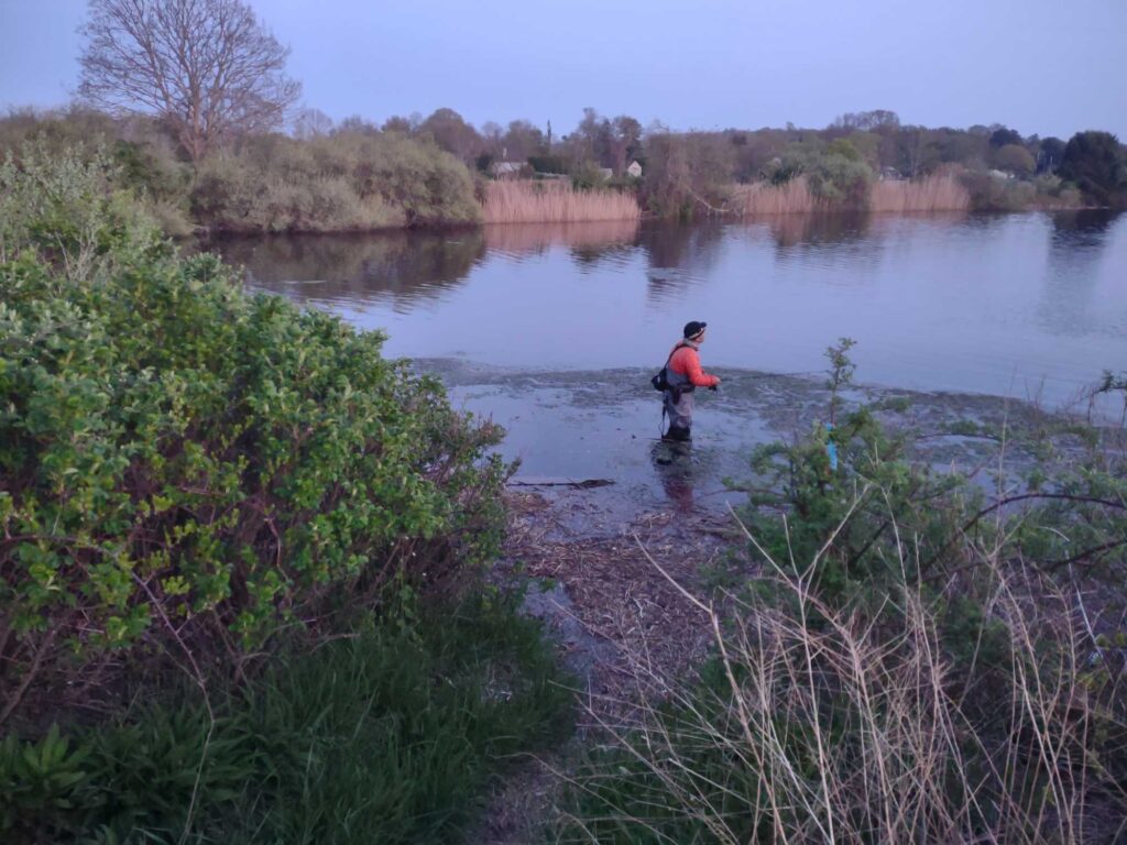 a person standing in a body of water (MyCoast AI)