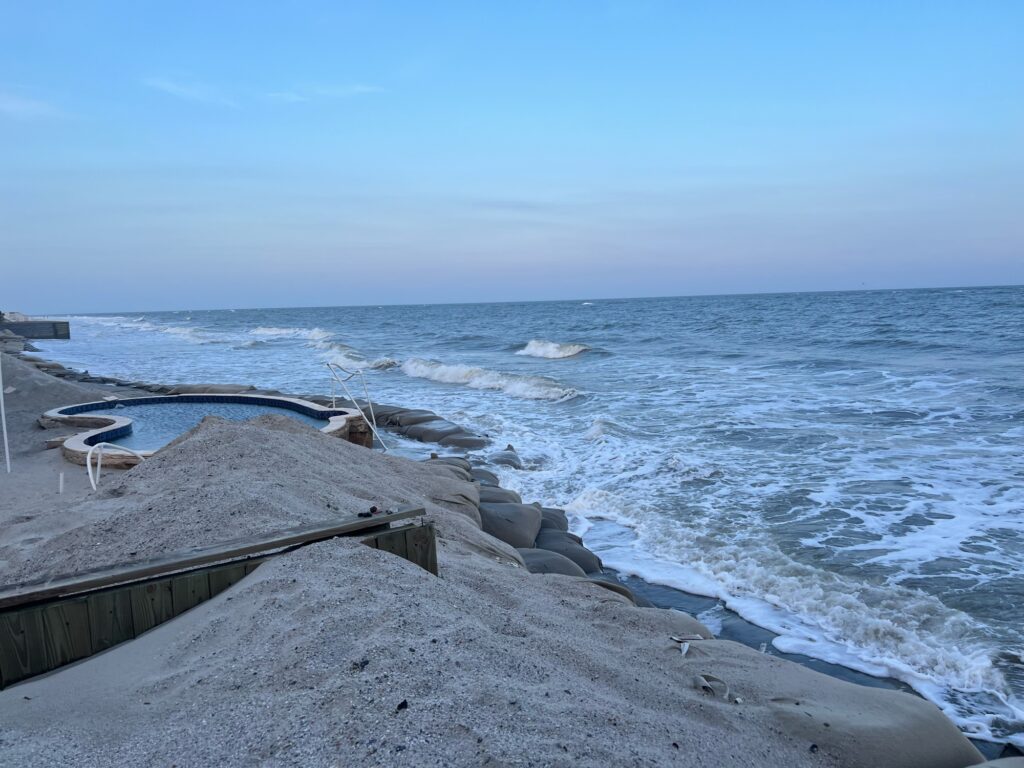 a rocky beach with waves crashing (MyCoast AI)