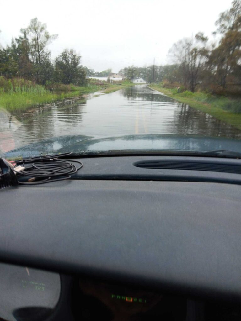 a car driving on a flooded road (MyCoast AI)