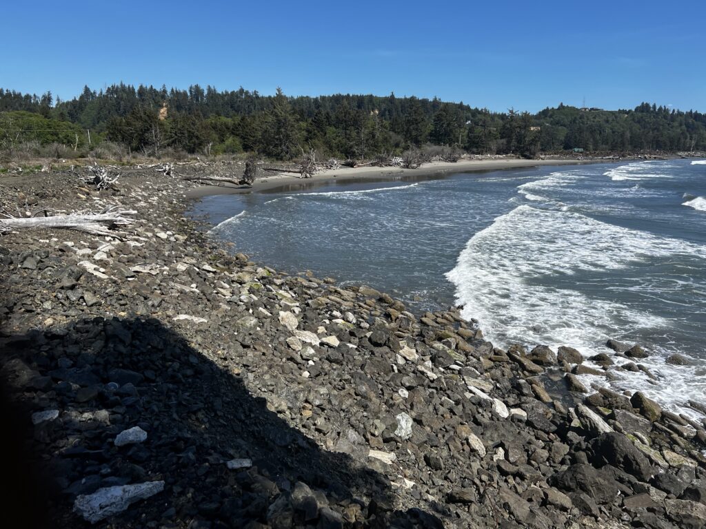a rocky beach with waves crashing (MyCoast AI)