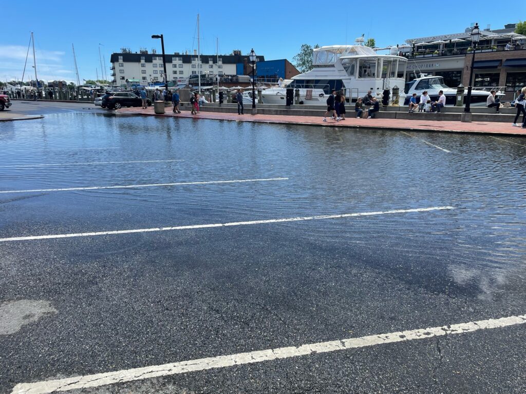 a parking lot with a body of water in the background (MyCoast AI)