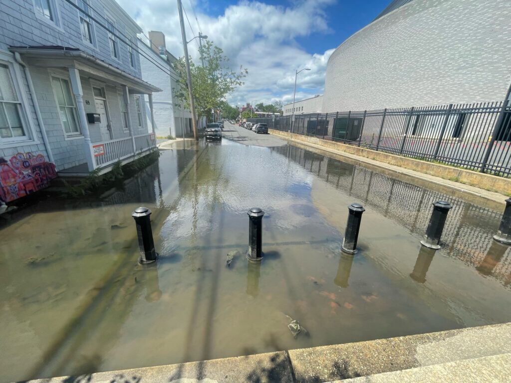 a flooded street with buildings (MyCoast AI)