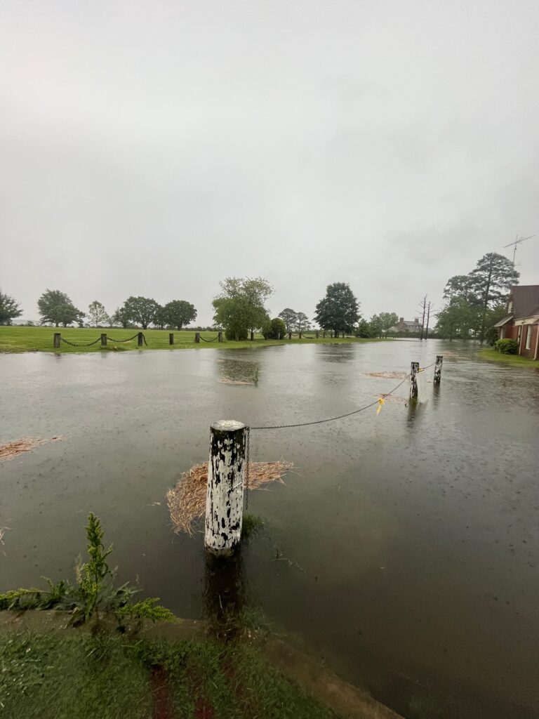 a flooded area with a sign (MyCoast AI)