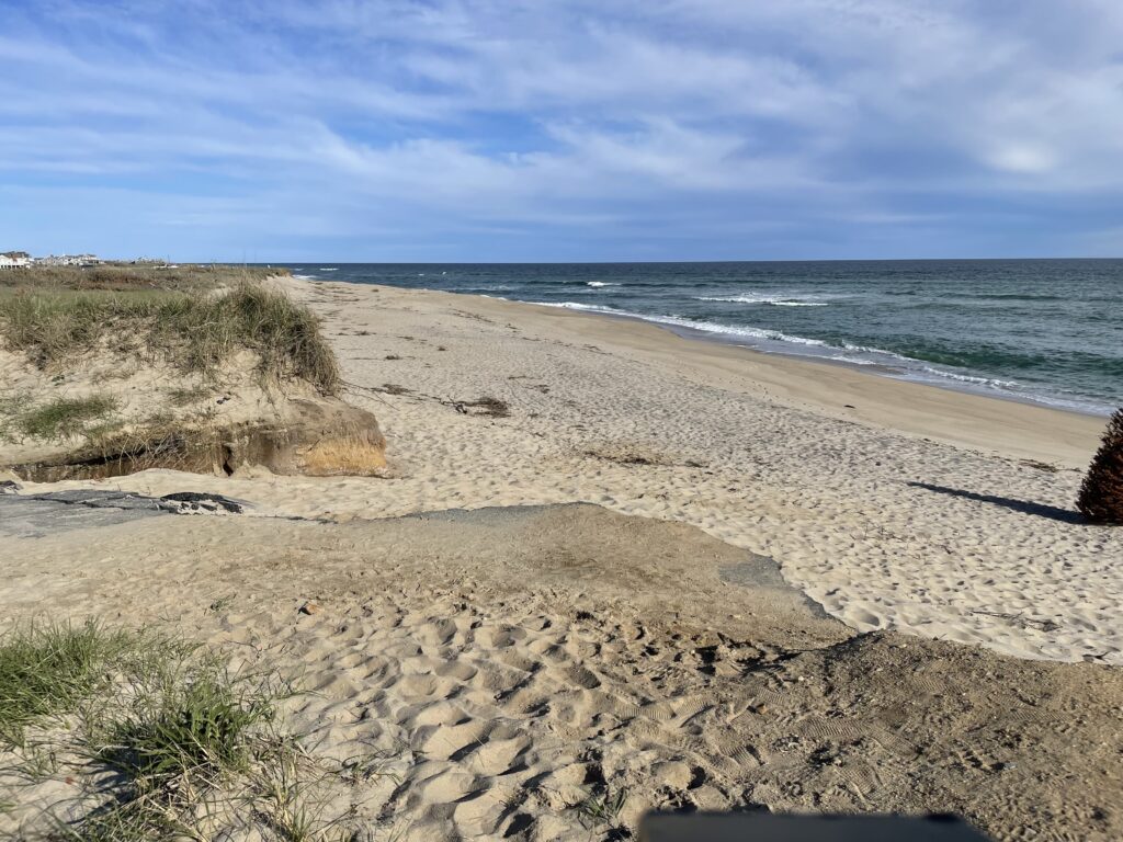 a sandy beach with waves crashing on it (MyCoast AI)