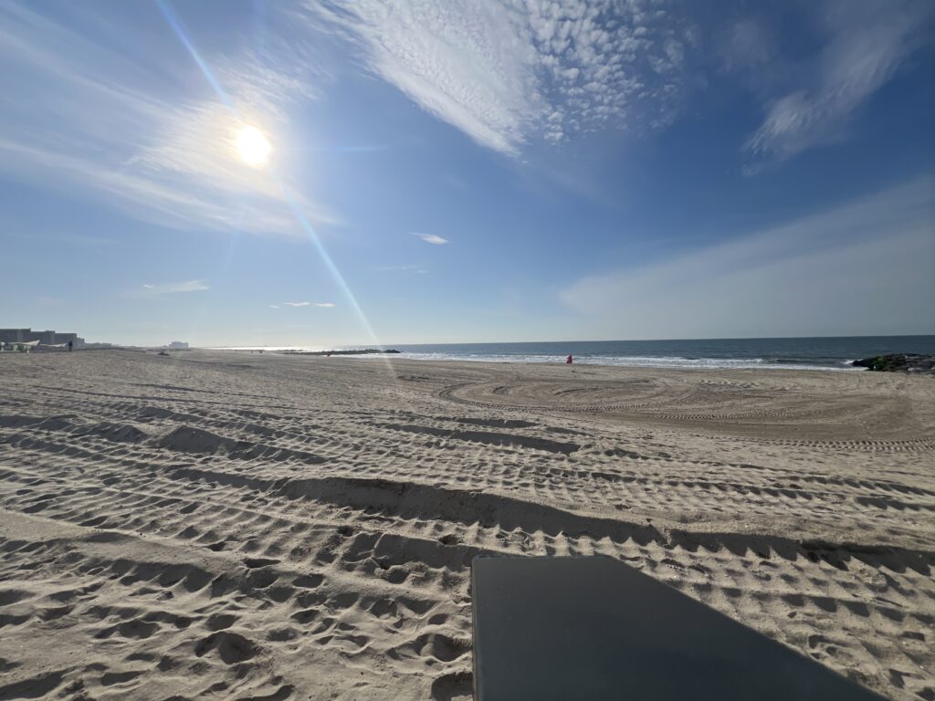 a sandy beach with the sun shining (MyCoast AI)