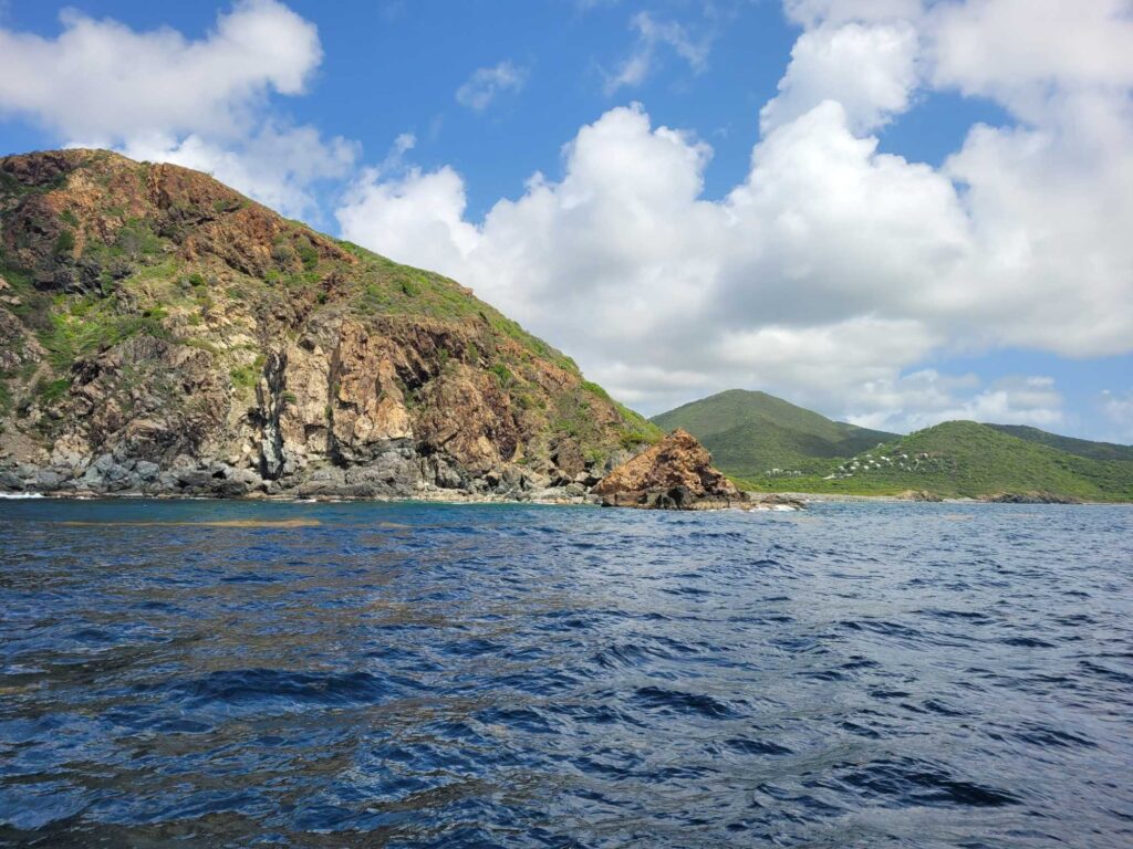 a body of water with hills in the background (MyCoast AI)