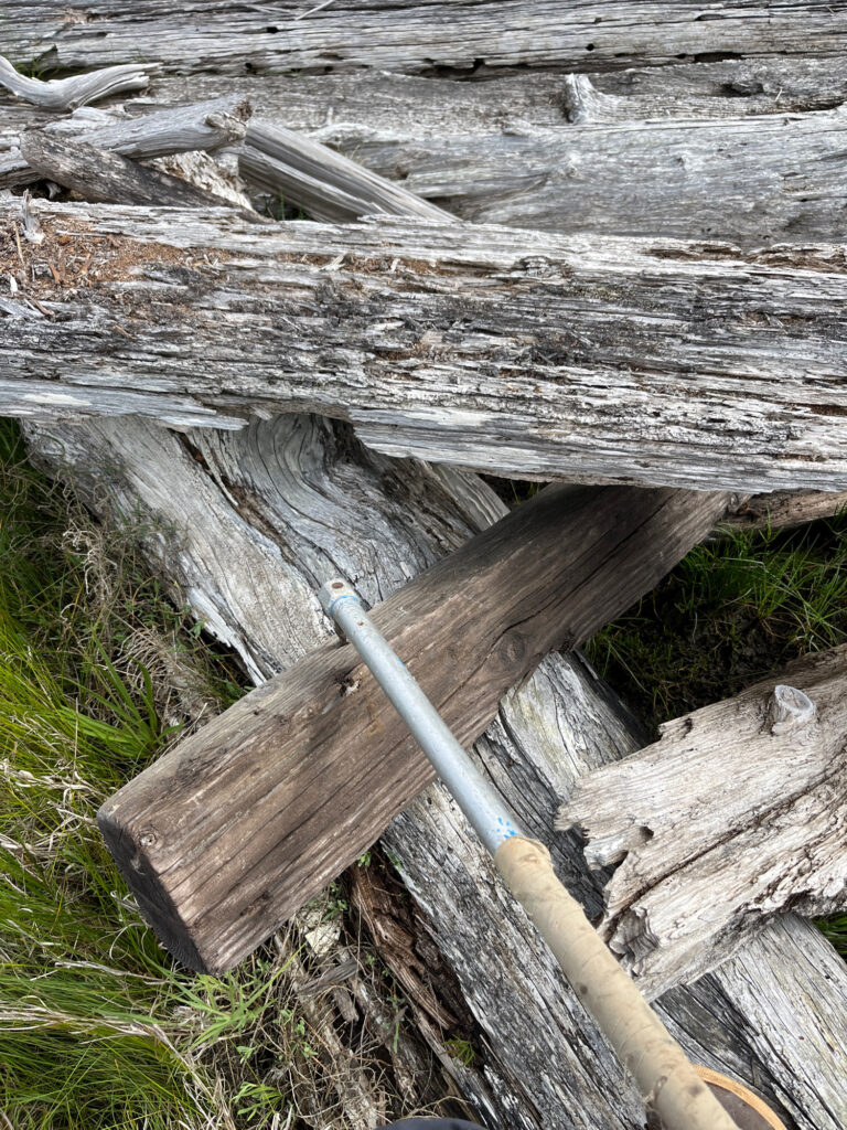 a wood fence with a metal rod (MyCoast AI)