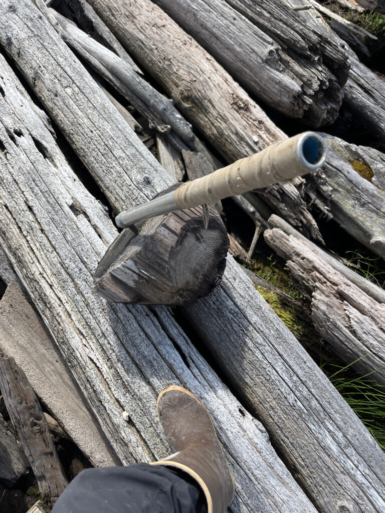a pipe on a wooden deck (MyCoast AI)