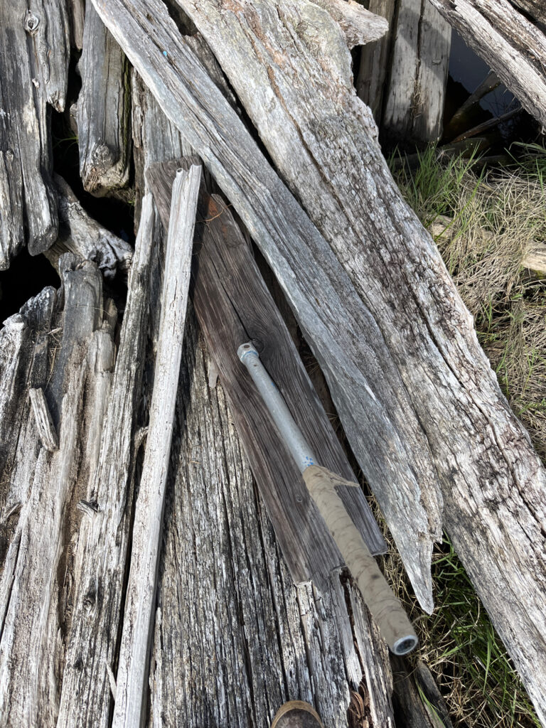 a wooden fence with a hole in it (MyCoast AI)