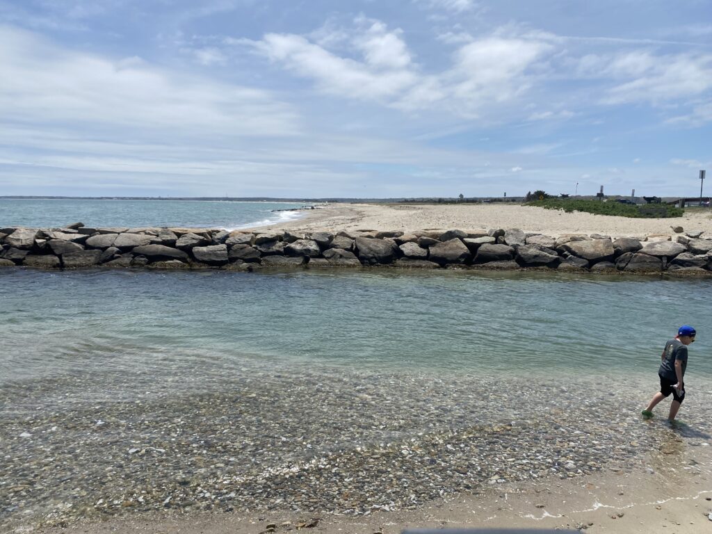a boy running on a beach (MyCoast AI)