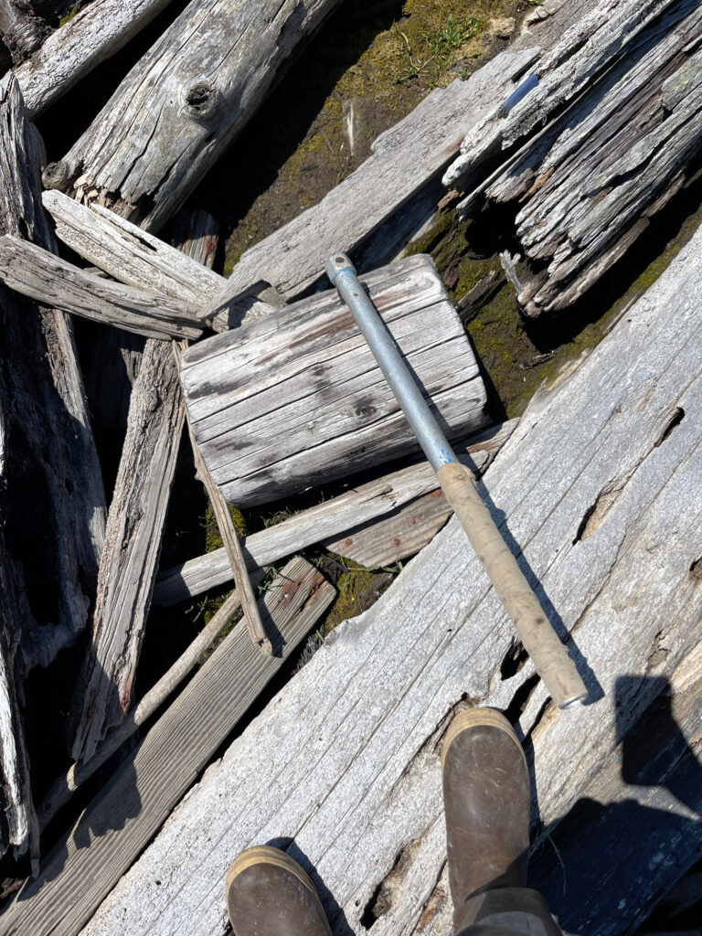 a wooden wheelbarrow full of wood (MyCoast AI)