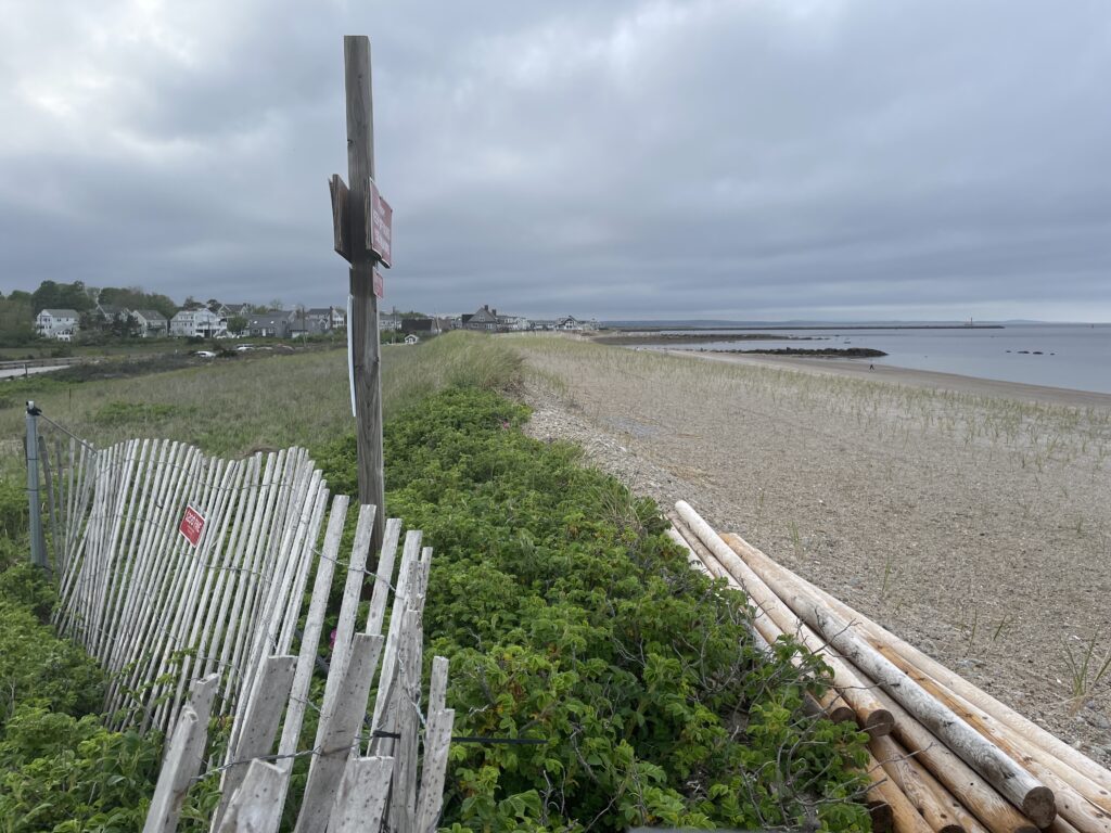 a wooden fence on a beach (MyCoast AI)