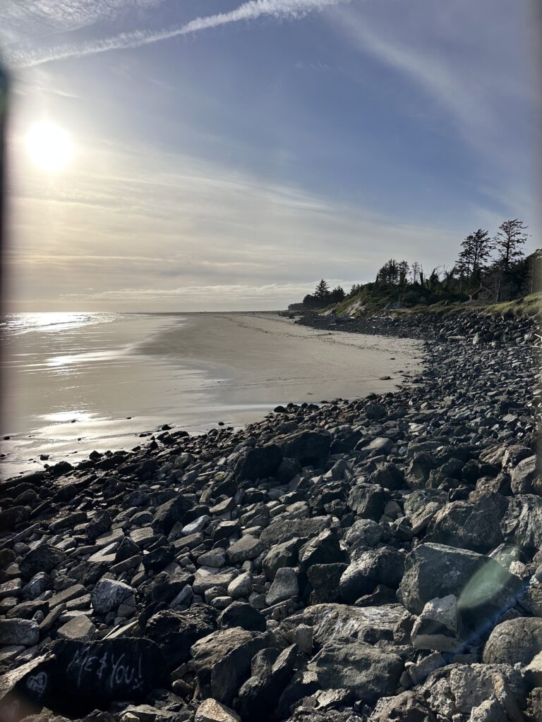 a rocky beach with the sun shining (MyCoast AI)