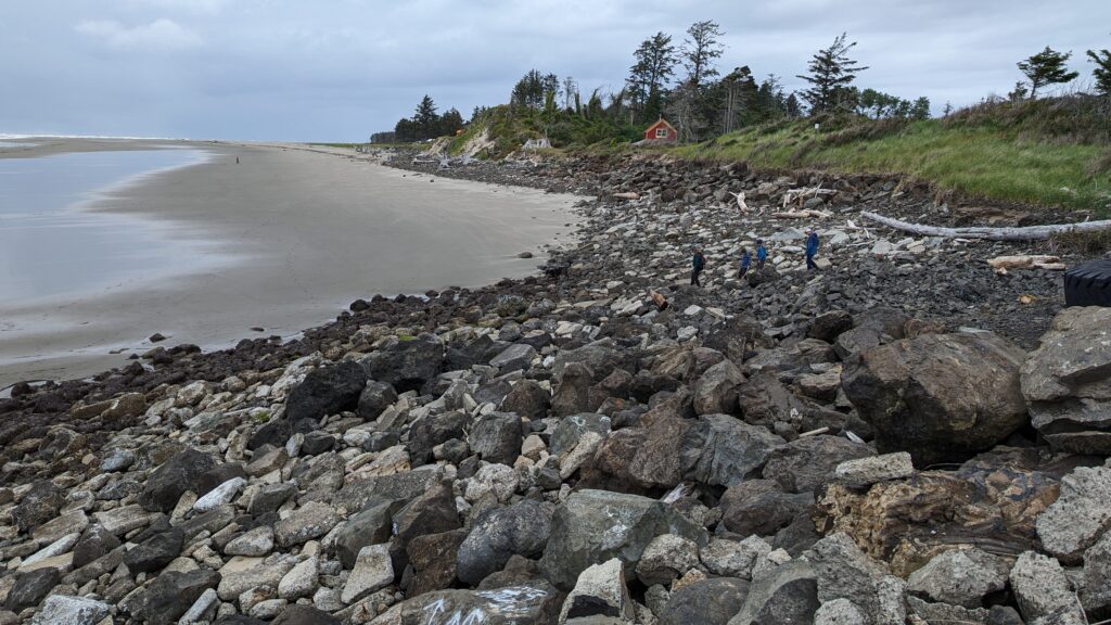 a rocky beach with people on it (MyCoast AI)