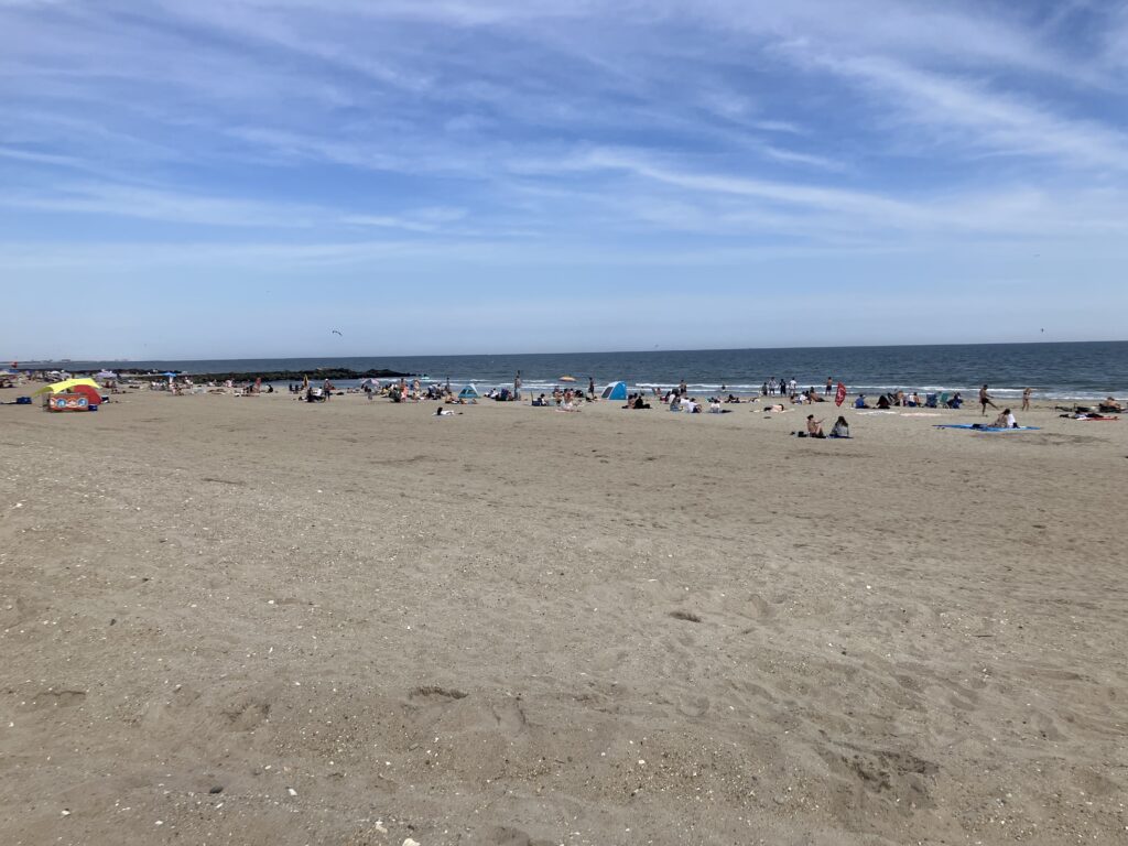 a beach with people and umbrellas (MyCoast AI)