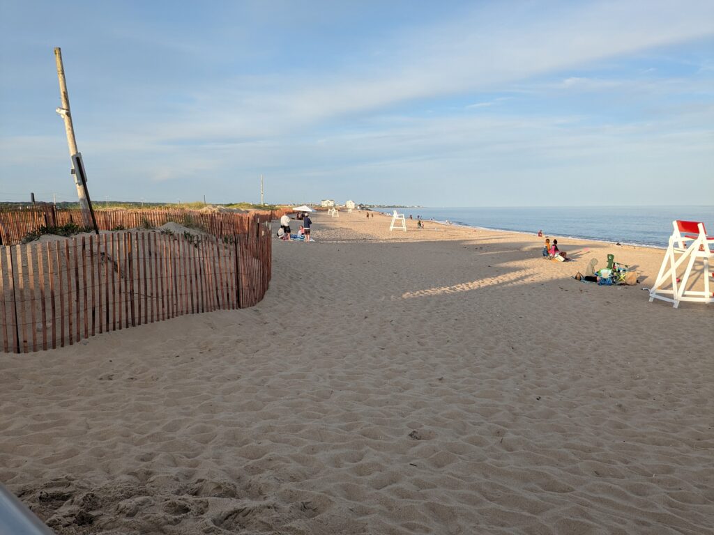 a sandy beach with a fence (MyCoast AI)