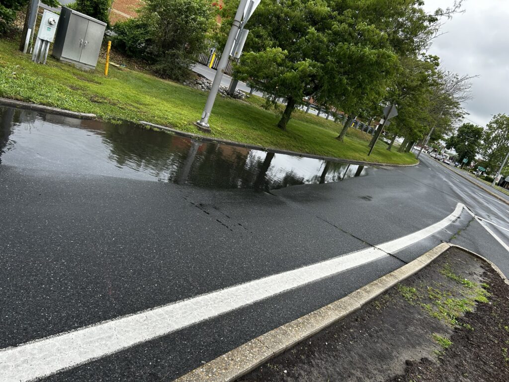 a flooded street with a puddle (MyCoast AI)