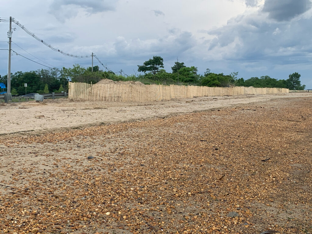 a dirt field with power lines (MyCoast AI)