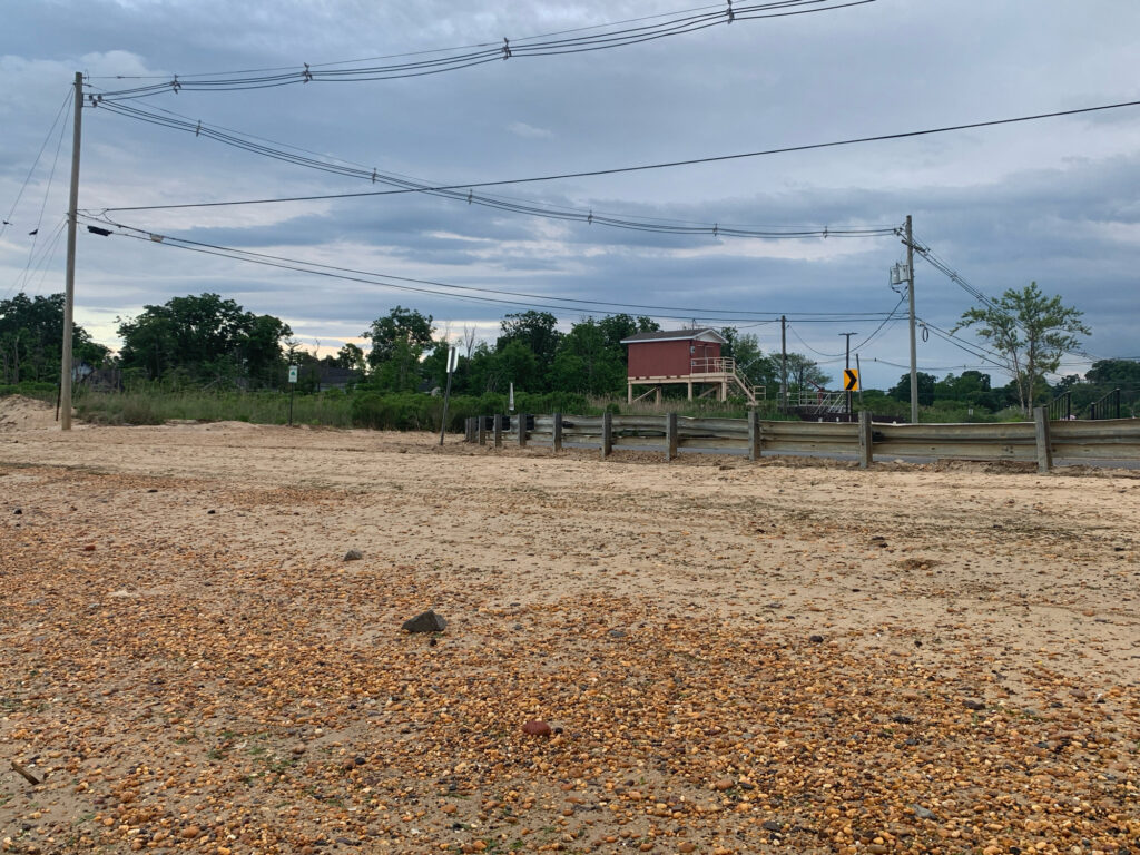 a dirt field with power lines (MyCoast AI)