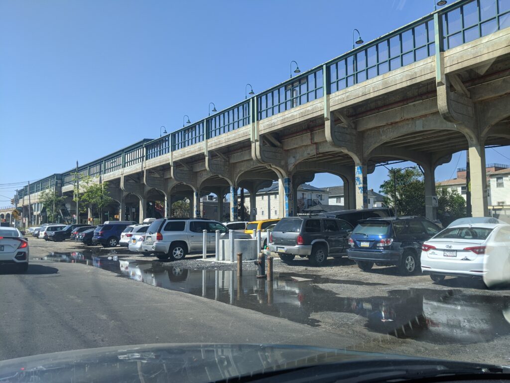 cars on a road under a bridge (MyCoast AI)