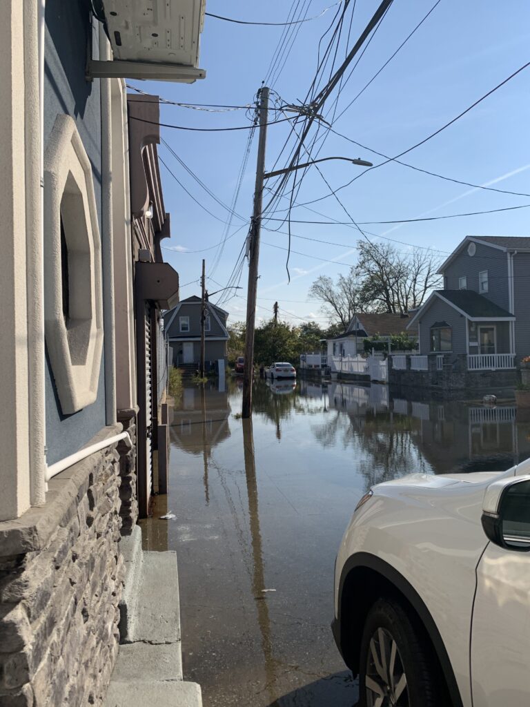 a flooded street with cars (MyCoast AI)
