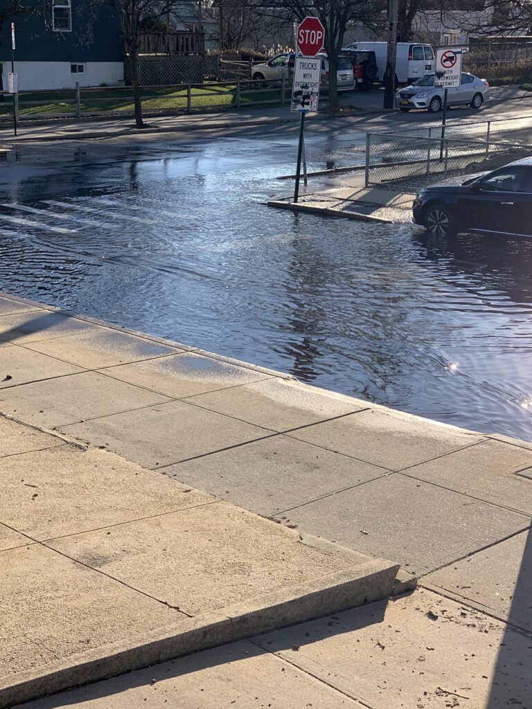a flooded street with a stop sign (MyCoast AI)