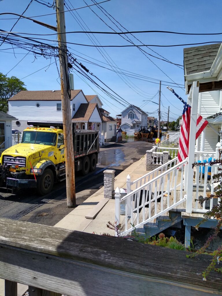a yellow truck parked on the side of a road (MyCoast AI)